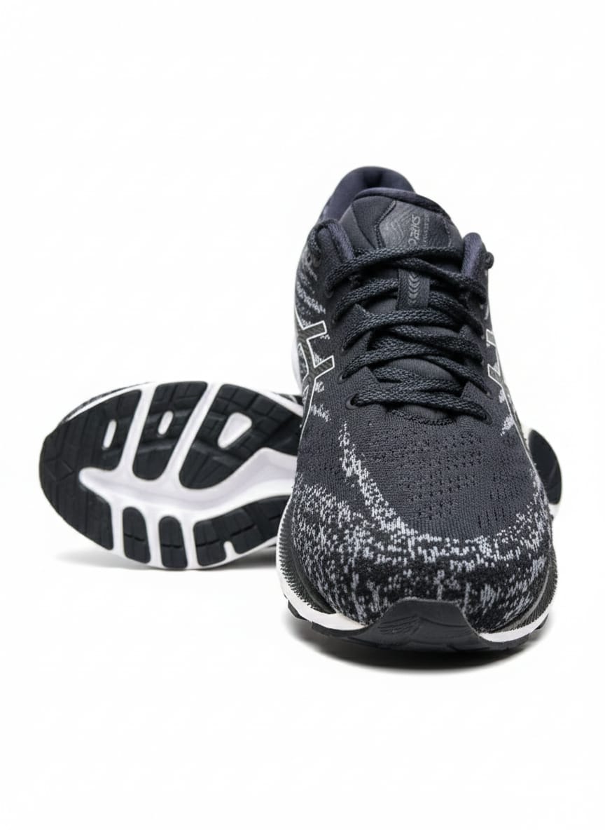 ASICS Gel-Kayano 29 in a Black and White Colorway with a Yellow/Gold Accent on the Heel