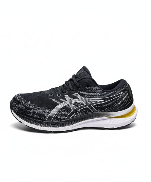 ASICS Gel-Kayano 29 in a Black and White Colorway with a Yellow/Gold Accent on the Heel