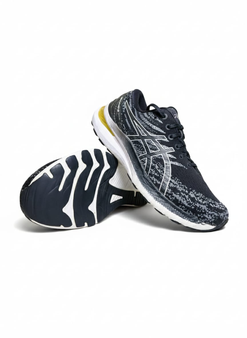 ASICS Gel-Kayano 29 in a Black and White Colorway with a Yellow/Gold Accent on the Heel